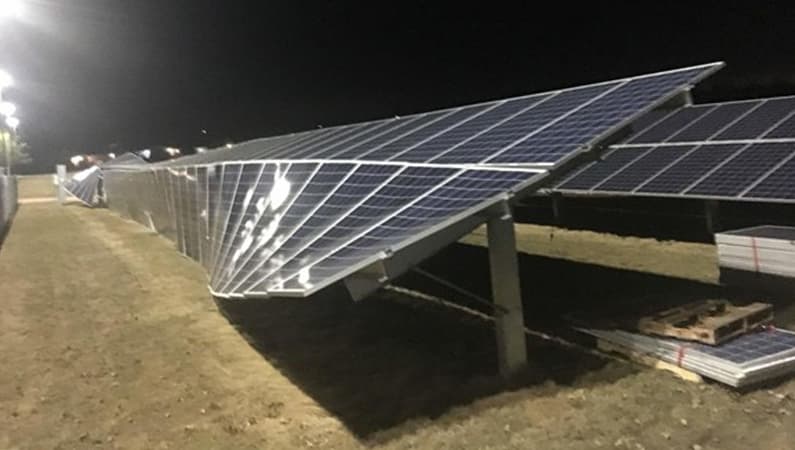 Aerial view of storm-damaged rooftop solar panels